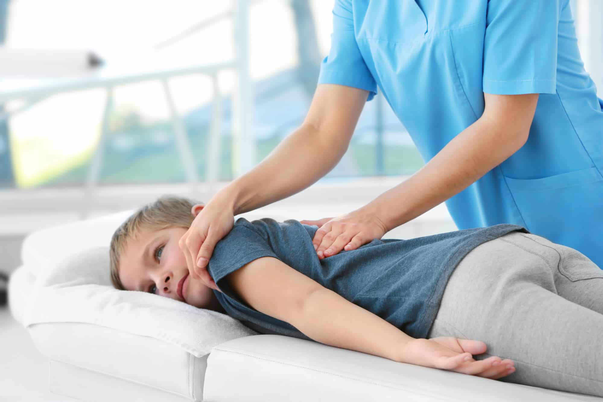 Healthcare professional providing gentle pediatric care to a newborn